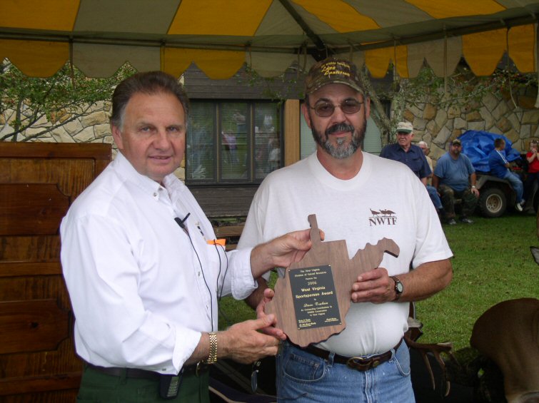 DNR Director Frank Jezioro presents the 2006 Sportsman of the Year Award to Dave Truban of Morgantown.