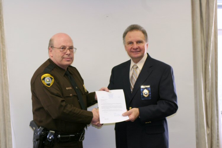 Captain Dan McKinney with DNR Director Frank Jezioro