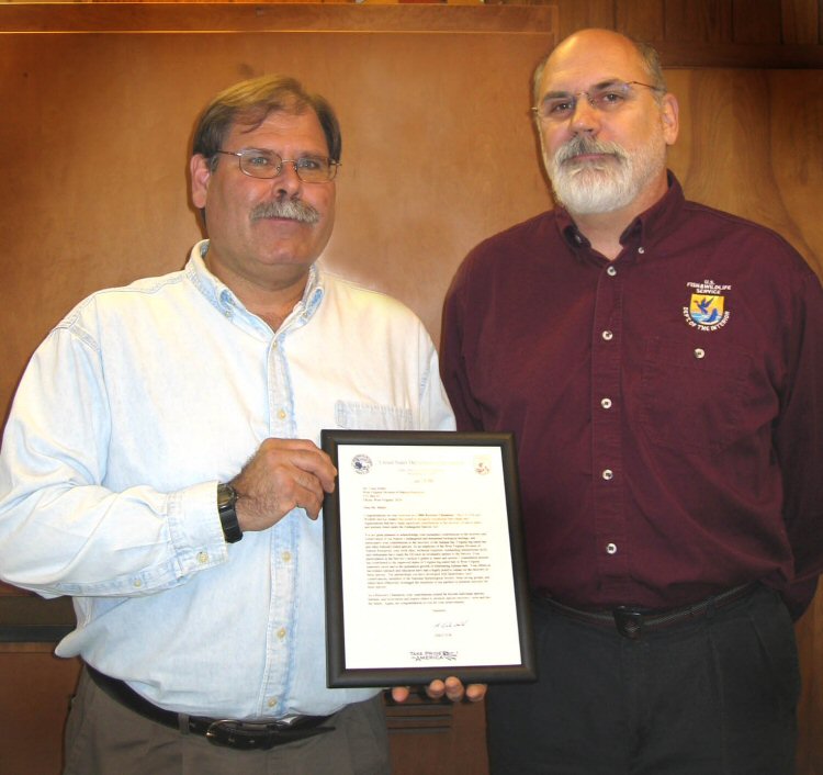 WVDNR biologist Craig Stihler, left, was recently awarded the national Recovery Champion Award by Tom Chapman, right, of the local U.S. Fish and Wildlife Services Elkins field office.