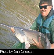 A guy holding a fish