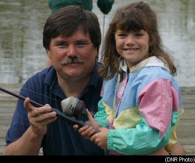 man and girl with fishing rod